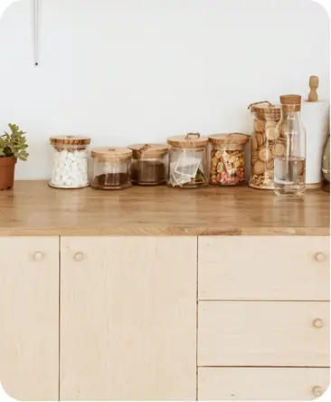 Kitchen countertop with containers of natural supplements and ingredients